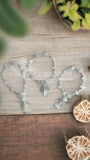 PULSERA DECENARIO DE ÓNIX NATURAL 12 CM LARGO, CON ANGELITO
